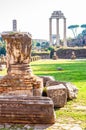 View on the Temple of Castor and Pollux through the ancient remains and ruins in Roman Forum in Rome