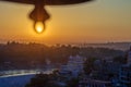 View from the temple under huge bell on River Ganga and Lakshman Jhula bridge at sunset. Rishikesh.