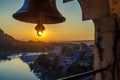 View from the temple under huge bell on River Ganga and Lakshman Jhula bridge at sunset. Rishikesh.