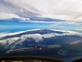 A view of Tenerife island and volcano Teide from the cockpit of ATR-72, the island surrounded by clouds, Canary Islands, Spain Royalty Free Stock Photo