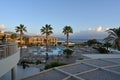 View from terase of hotel on the palm trees and swimming pool in Holiday resort TUI Magic Life Candia Maris.