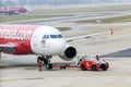 Thai AirAsia on airstrip runway before taking off from Bangkok airport, Thailand