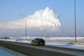 View of the thermal power plants from the highway. Pipes of thermal power plants emit thick smoke. Thermal power plants in thick Royalty Free Stock Photo