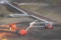 View of thermoelectric geothermal power and heating plant close to Krafla, Iceland with visible pipes going through scener.and