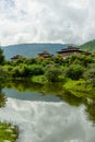 View of Thimphu dzong from Ludrong park with a lake