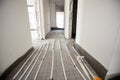 Pipe system of floor heating mounted in residential building under construction Royalty Free Stock Photo
