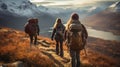 View of three backpackers walking up the mountain in beautiful remote arctic wilderness