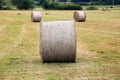 Three bales of hay in the mountain fields Royalty Free Stock Photo