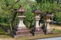 A kaku-doro traditional stone square lanterns in the Kitano Tenmangu shrine. Kyoto. Japan Royalty Free Stock Photo