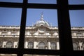 View thru window on the arches and windows in the yard of majestic, beautiful Royal Palace of Madrid (Palacio Real de Madrid) in Royalty Free Stock Photo