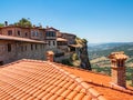 View of tiled roofs and ancient buildings in the Megala Meteora Monastery in Meteora, Greece
