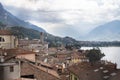 View of tiled roofs, mountains and cloudy overcast sky in Lovere town, Lake Iseo, Italy Royalty Free Stock Photo