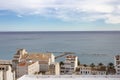 View of the tiled roofs of the village of Altea, overlooking the skyline connecting the sea and blue sky with beautiful Royalty Free Stock Photo