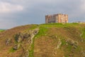 View of Tintagel Island and legendary Tintagel castle. Royalty Free Stock Photo