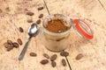 Tiramisu in a pot on a wooden table