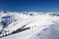 View to Alpine mountains and ski slopes in Austria from Kitzbuehel ski resort.