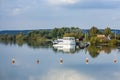 View to Altmuehl river in Bavaria with tourist ship on pier and reflection of coastline Royalty Free Stock Photo