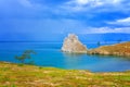 View to Baikal lake with Burkhan cape and Shamanka rock at Olkhon island in approaching thunderstorm. Beautiful summer landscape