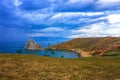 View to Baikal lake with Burkhan cape and Shamanka rock at Olkhon island in approaching thunderstorm. Beautiful summer landscape