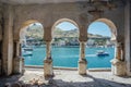 View to Balaklava bay through arched balcony in oriental style. Abandoned mansion on Black Sea coast. Royalty Free Stock Photo