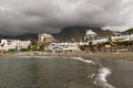 View to the beach with natural dark sand. Royalty Free Stock Photo