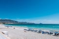 View to beautiful Albir seaside beach with beach chairs and umbrellas. Albir is small resort city near Mediterranean sea Royalty Free Stock Photo