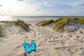 View to beautiful landscape with beach, sand dunes and flip flops near Henne Strand, Jutland Denmark Royalty Free Stock Photo