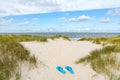 View to beautiful landscape with beach, sand dunes and flip flops near Henne Strand, Jutland Denmark Royalty Free Stock Photo