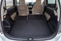 View to the beige interior of Toyota Passo with trunk and folded rear seatbacks of hatchback after cleaning before sale on parking Royalty Free Stock Photo