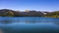 View to Bolboci lake from the damb with carpathian mountains at