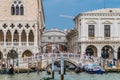 View to bridge of sighs in Venice, Italy. Crowds of tourists crossing the bridge at Doges Palace