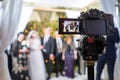 View to the camera display recording Jewish chasid wedding