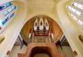 View to the ceiling and pipe organ musical instrument inside of Sanctuary of Santa Maria