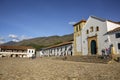 View to the Church of our Lady of the Rosary and historical buildings at Plaza Mayor of Villa de Leyva, against blue sky,