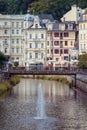 A view to the city center with river and splashing fountain at spa Karlovy Vary Royalty Free Stock Photo