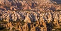 View to cliff dwellings in Cappadocia, Turkey. Ancient cavetown near Goreme on the sunset