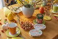 View to a View to a colorful easygoing family breakfast table decorated for Easter