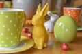 View to a colorful easygoing family breakfast table decorated for Easter