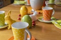 View to a colorful easygoing family breakfast table decorated for Easter