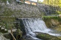 View to Dam on the Lomnica River, semicircular dam with five overflows, on the Lomnica River, in Karpacz, Poland Royalty Free Stock Photo