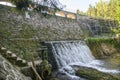 View to Dam on the Lomnica River, semicircular dam with five overflows, on the Lomnica River, in Karpacz, Poland Royalty Free Stock Photo