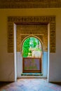 A view to a garden through arched windows. Alhambra Palace, Granada, Andalucia, Spain....IMAGE Royalty Free Stock Photo