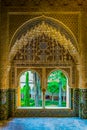 A view to a garden through arched windows. Alhambra Palace, Granada, Andalucia, Spain....IMAGE Royalty Free Stock Photo