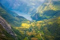 View to the Geiranger fjord with green valley surrounded by mountains, Geiranger, Sunnmore region, More og Romsdal county, Norway Royalty Free Stock Photo