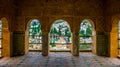 A view to Granada through arched windows. Alhambra Palace, Granada, Andalucia, Spain....IMAGE Royalty Free Stock Photo