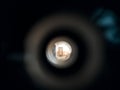 View to the hall through peephole eyelet in the door.