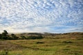 View to hills of savanna under stunning sunny cloudy sky Royalty Free Stock Photo