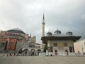 View to historical Fountain of the Ahmed III and Hagia Sophia mosque and museum in background, Istanbul