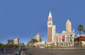 view to hotels and casinos at the Strip in daytime with neon advertising and the Venetian tower in the middle