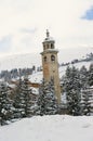 View to the inclining bell tower at the ski resort town of St. Moritz, Engadine valley, Switzerland.